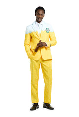 A man wearing a colorful Suitmeister suit that mimics the design of an iconic beverage can. The suit is light blue on the top and transitions to yellow at the bottom, featuring a printed Premium Beer Yellow logo on the chest. He holds a bottle and stands against a white background.