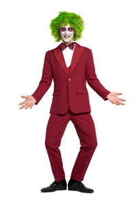 A person dressed in the Suitmeister Beetlejuice Groom outfit, with a bow tie and vivid green wig, strikes a playful pose. Their face is painted white with dark eye makeup, resembling a theatrical or whimsical character, against a plain white background.