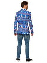 A man stands with his back to the camera, donning a Christmas Blue Nordic Jacket from Suitmeister, featuring white and red holiday patterns such as snowflakes and reindeer. He pairs it with blue jeans and black sneakers against a plain white background.