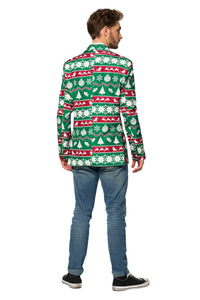 A person is standing with their back to the camera, wearing a Suitmeister Christmas Green Nordic Jacket, featuring holiday-themed patterns like snowflakes and reindeer. They are also wearing blue jeans and black sneakers.