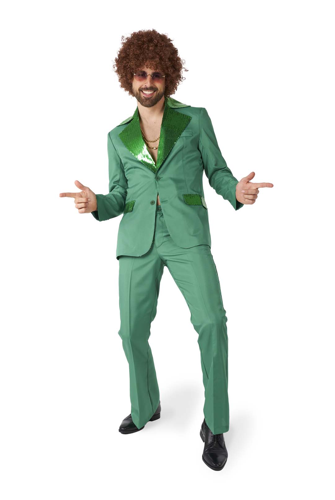 A person dressed in the Suitmeister Disco Suit Green, featuring a shiny lapel and paired with a green shirt, strikes a playful pose while wearing a curly wig and sunglasses, with fingers pointing outward.