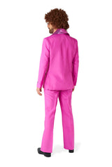 A person with curly hair is wearing a Disco Suit Pink by Suitmeister, which features a shiny collar. They are standing and facing away from the camera.