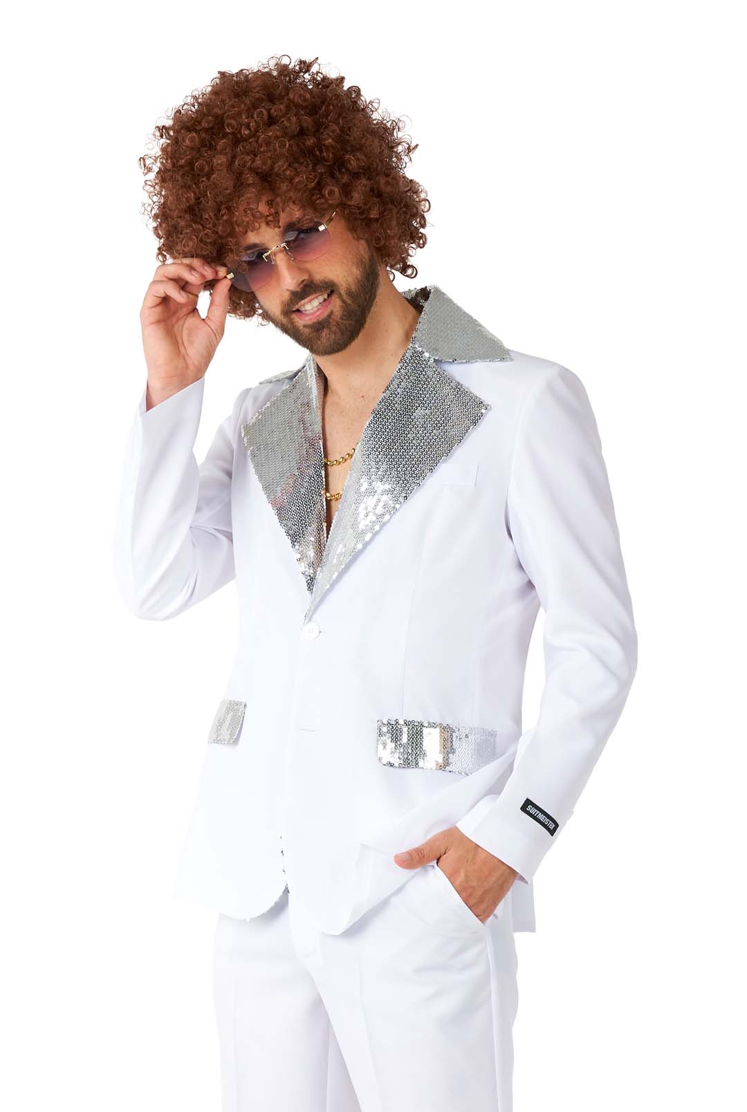 A person dressed in a Disco Suit White from Suitmeister, accessorized with sunglasses and a curly wig, poses against a white background.