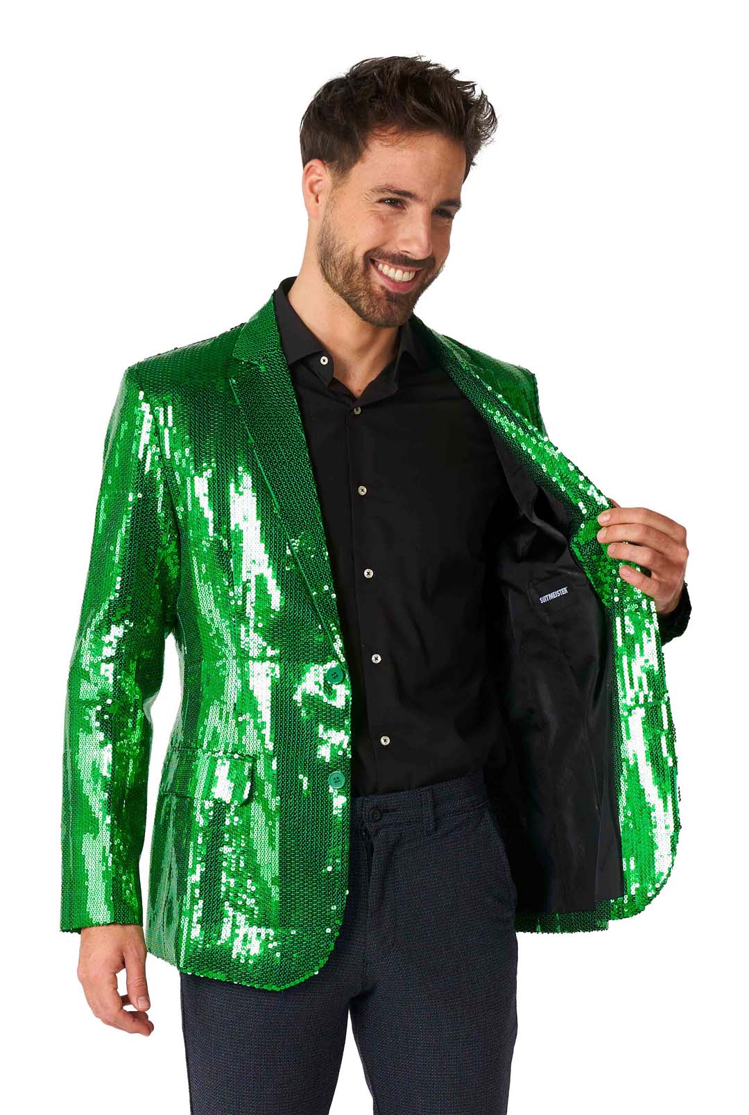 A smiling man is wearing the Suitmeister Sequins Blazer Green over a black shirt and dark pants. He's holding one side of the blazer open, revealing its black lining.