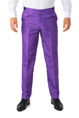 A person wearing the Joker™ Tailcoat Suit Purple by Suitmeister, which includes vibrant purple pinstripe dress pants and a white shirt, along with black dress shoes, is standing. The image focuses on the lower half of the body against a plain white background.