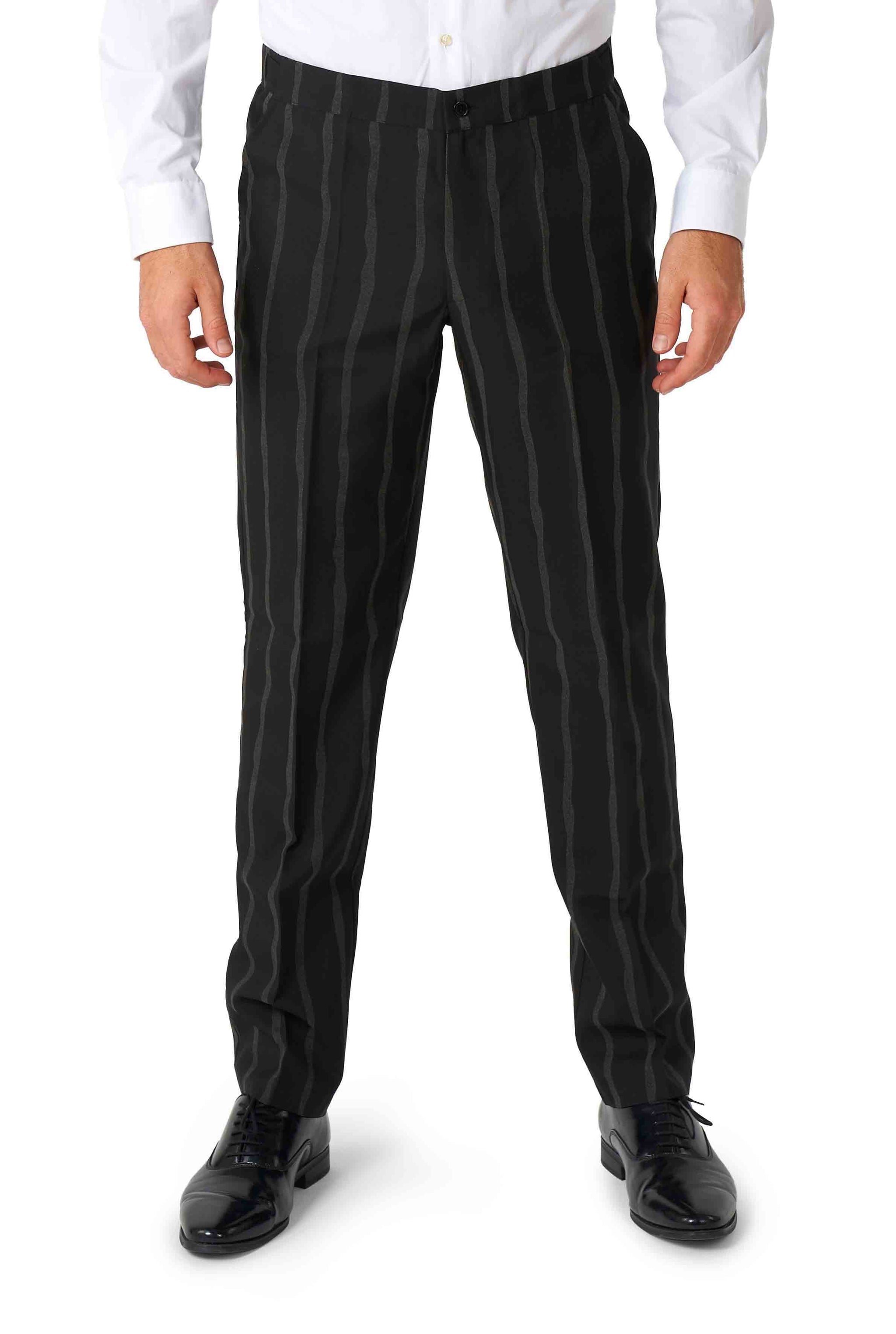 A person dressed in an Oversized Pinstripe Black shirt by Suitmeister and black trousers with vertical gray stripes, standing with arms by their sides. The trousers are complemented by black dress shoes.