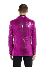 A person is facing away from the camera, wearing a shimmering Suitmeister Sequins Blazer Pink paired with black pants, set against a plain white background.