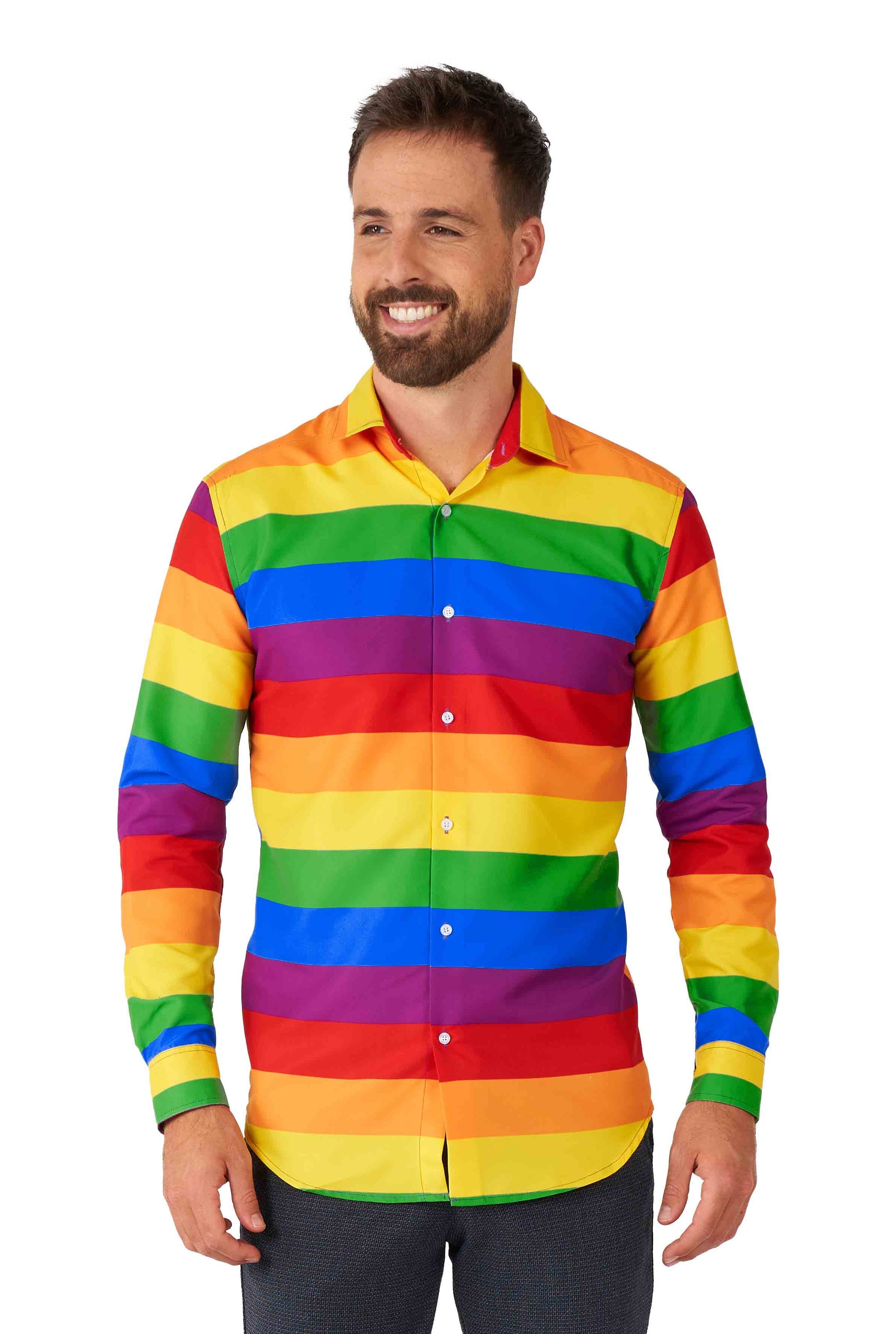 A smiling man wearing the Rainbow shirt by Suitmeister, featuring horizontal rainbow stripes and long sleeves, stands against a plain backdrop.