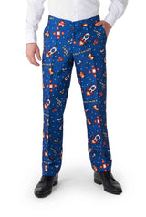 A person dressed in the Retro Gamer Navy - Gamer suit by Suitmeister, which features blue trousers adorned with a retro video game pattern showcasing spaceships, asteroids, and the colorful text CONTINUE? They pair this with a white shirt and black shoes.