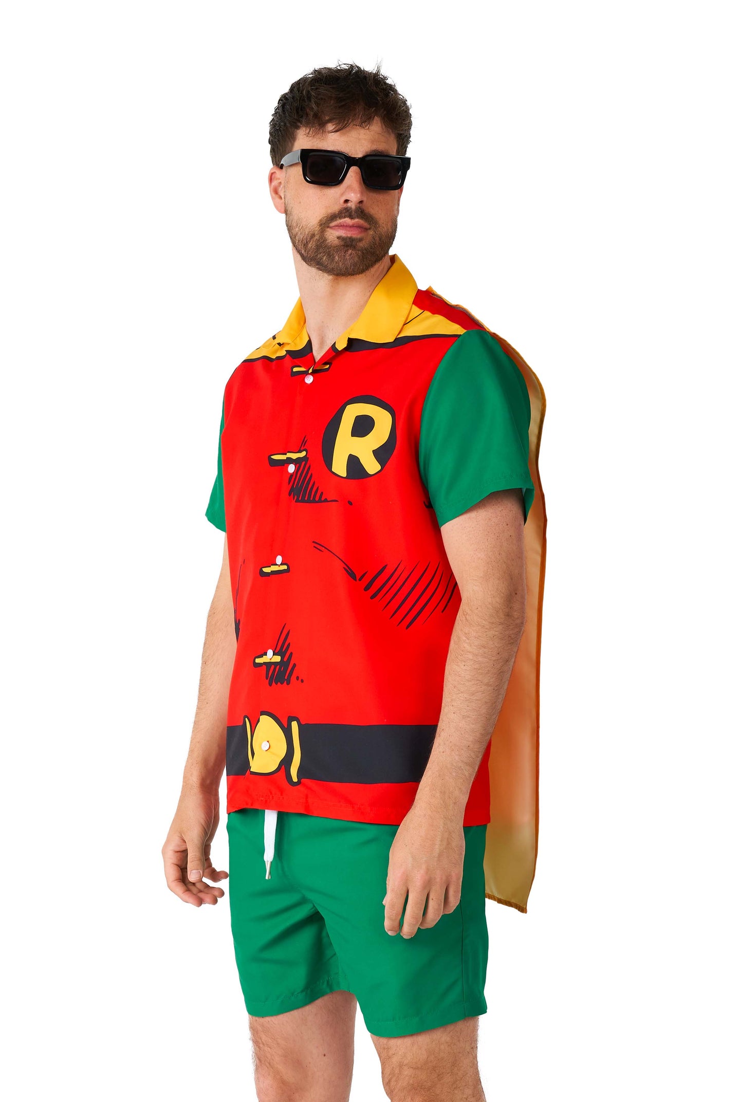 A man sporting the Suitmeister Robin costume, complete with a vibrant red and yellow top, green shorts, and a cape, accessorized with sunglasses. He is posed casually against a plain white backdrop.