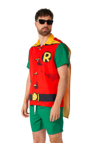 A man sporting the Suitmeister Robin costume, complete with a vibrant red and yellow top, green shorts, and a cape, accessorized with sunglasses. He is posed casually against a plain white backdrop.