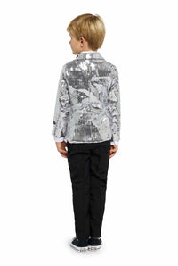 A young boy stands with his back to the camera, wearing the Suitmeister "Sequins Silver - Sequin Blazer" with black pants and black shoes. He has short blonde hair and is posed against a plain white background.