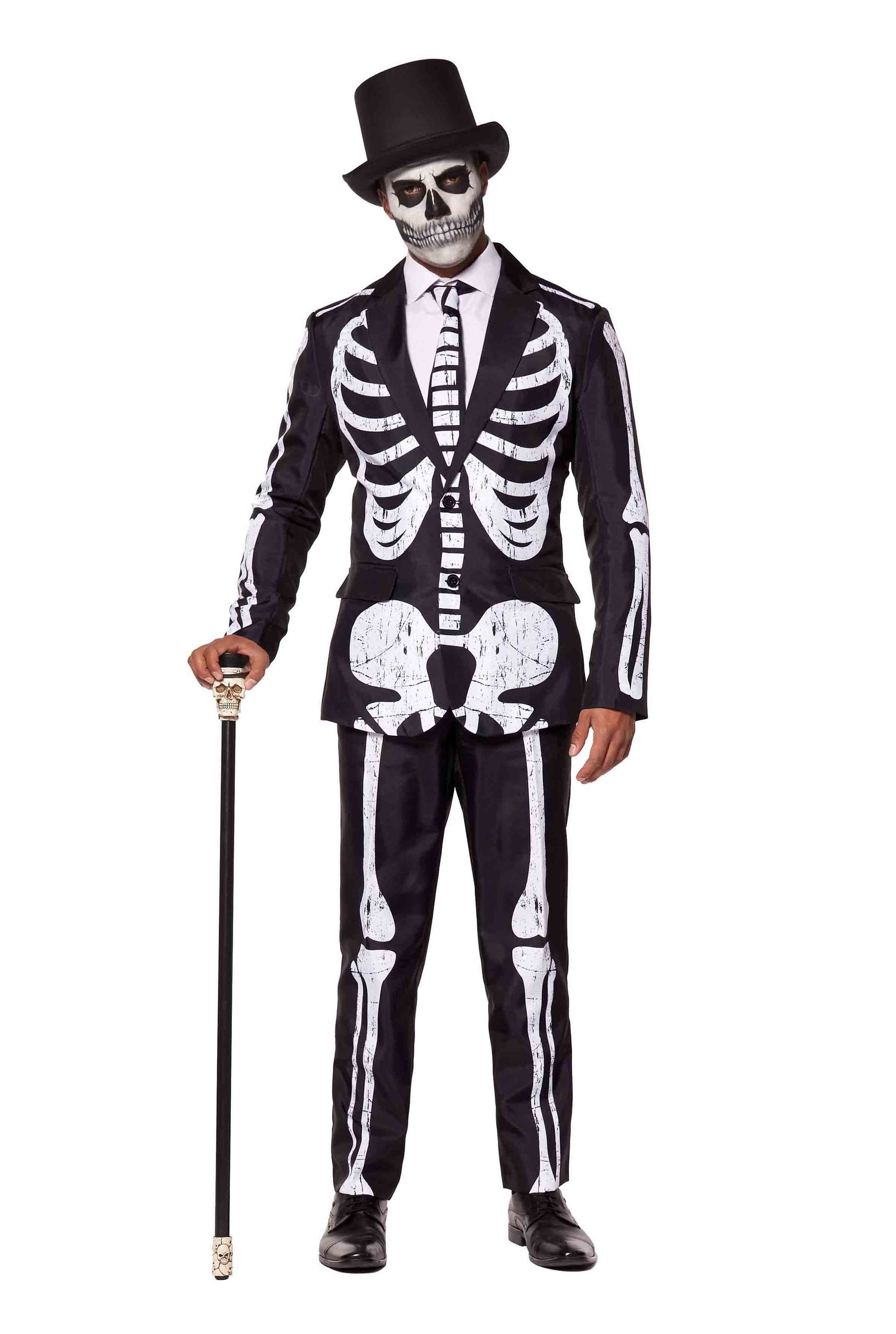 A person dressed in the Suitmeister's Skeleton Grunge Black ensemble, complete with a matching tie and skeletal face paint, is accessorized with a top hat and cane. The outfit features a distinctive white skeletal pattern against a black background.