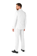 A man wearing the well-fitted Suitmeister Solid White suit and black shoes stands facing away, appearing to look to his left against a plain white background.