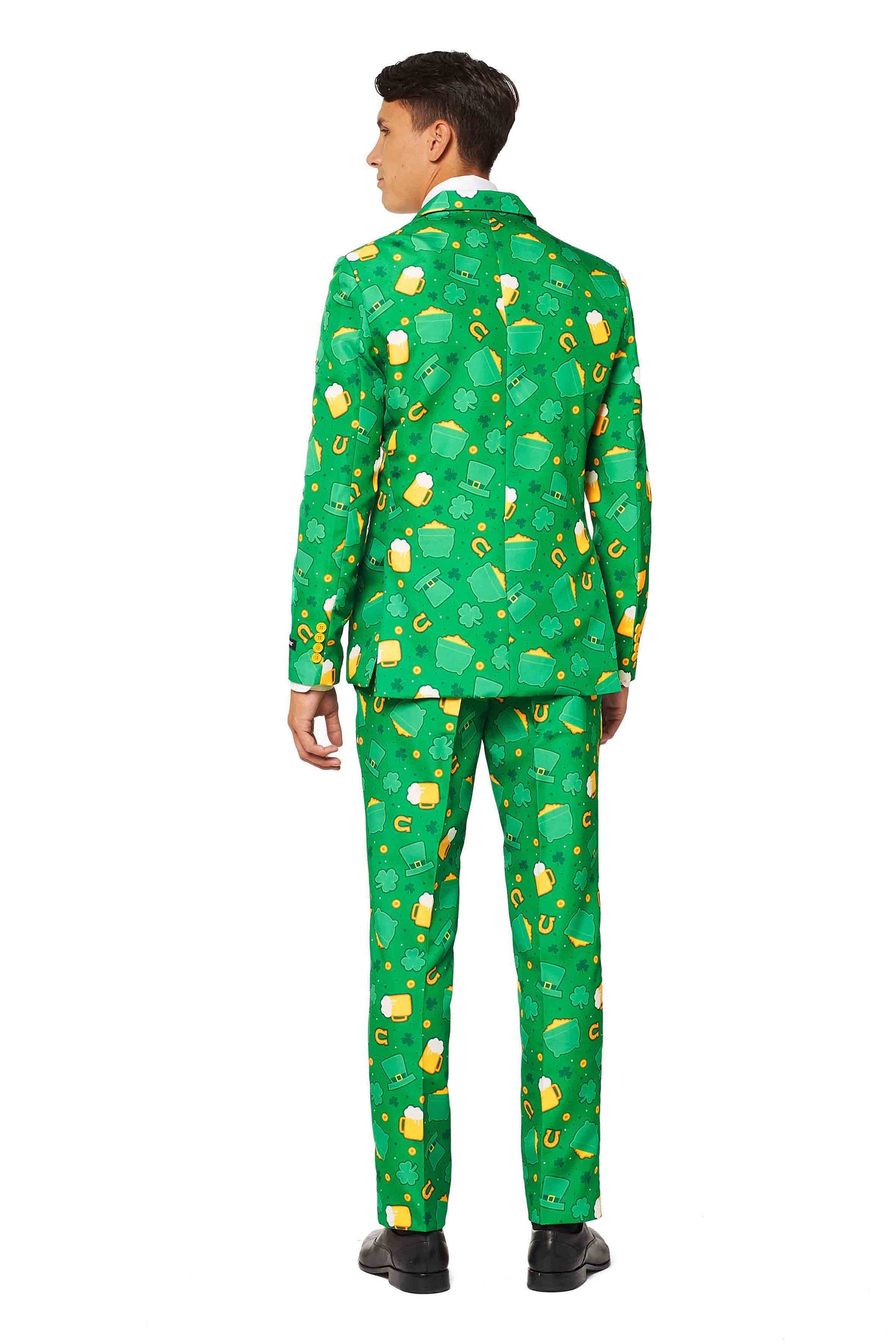 A person is wearing the "St. Patrick's Day Icons" suit by Suitmeister, featuring a vibrant green design with patterns that echo the theme of honey jars and bees. They are standing with their back to the camera and are paired with black shoes.